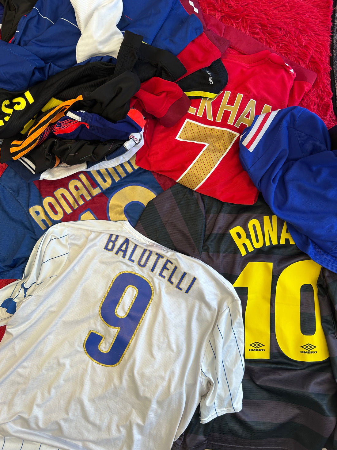 Pile of vintage football shirts