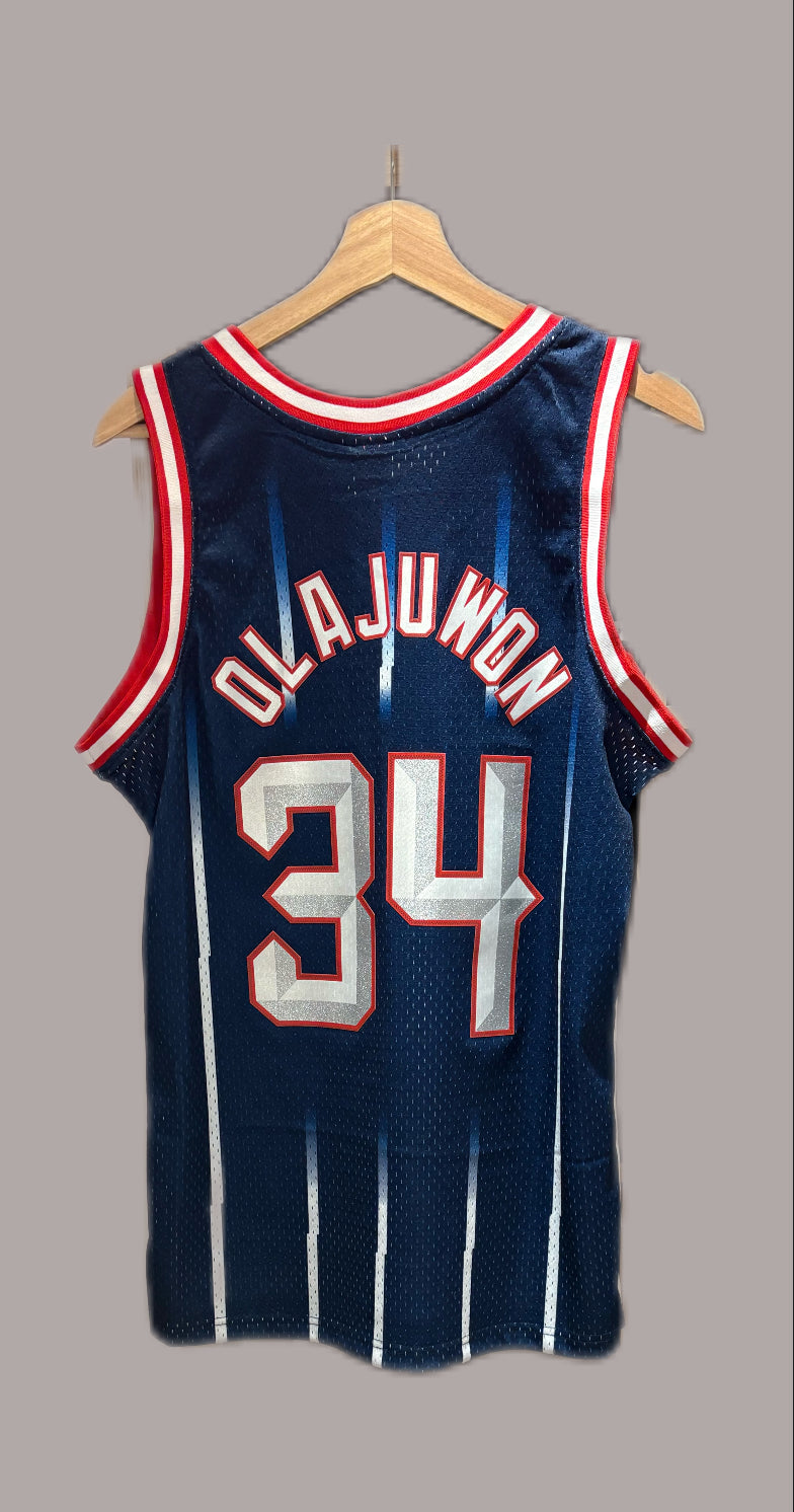 Vintage Hakeem Olajuwon Houston Rockets 1996-97 Hardwood Classics Swingman road jersey in navy blue.