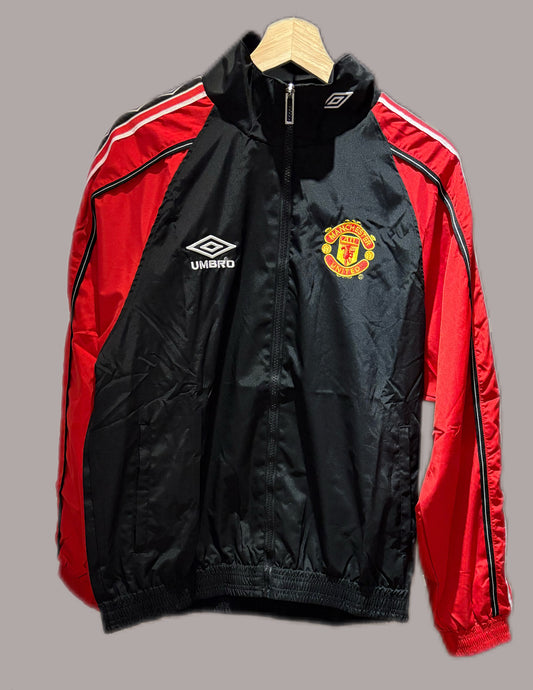 Vintage Manchester United 1998-99 Treble Winning track jacket in black and red.