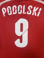 PODOLSKI 9 name and number close-up