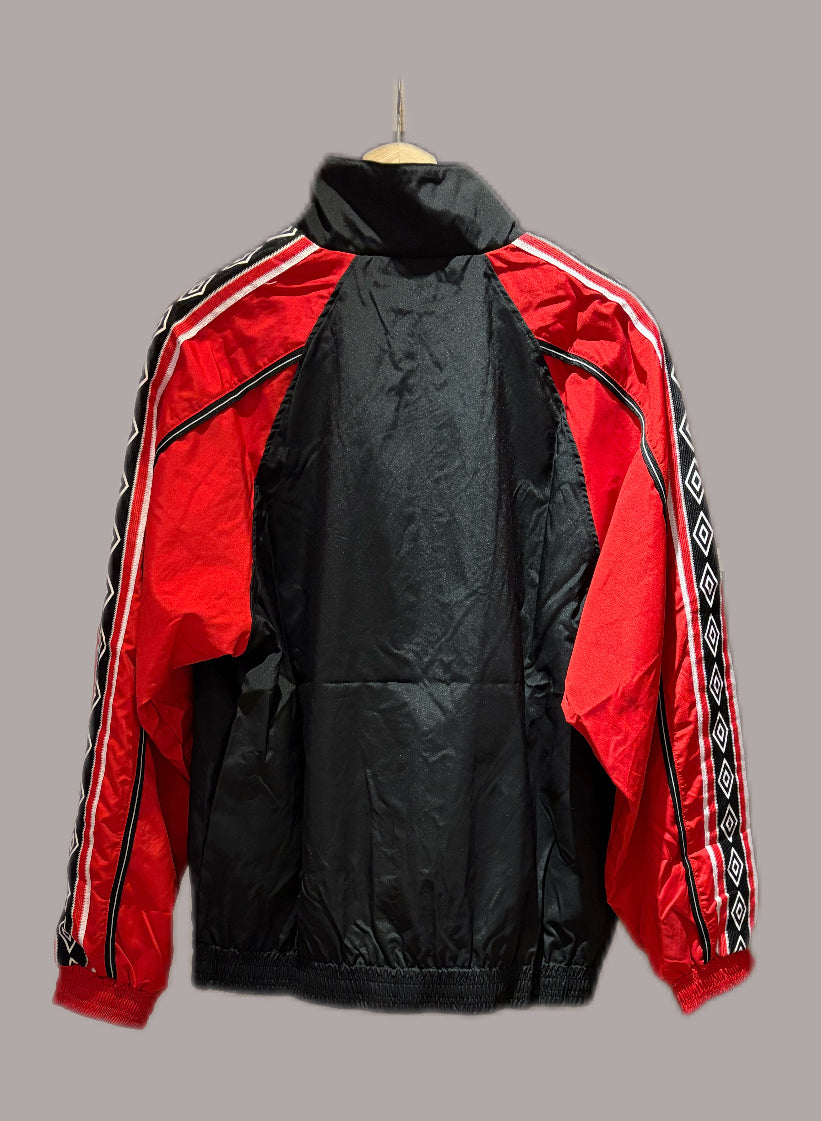 Vintage Manchester United 1998-99 Treble Winning track jacket in black and red.