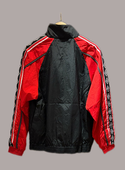 Vintage Manchester United 1998-99 Treble Winning track jacket in black and red.