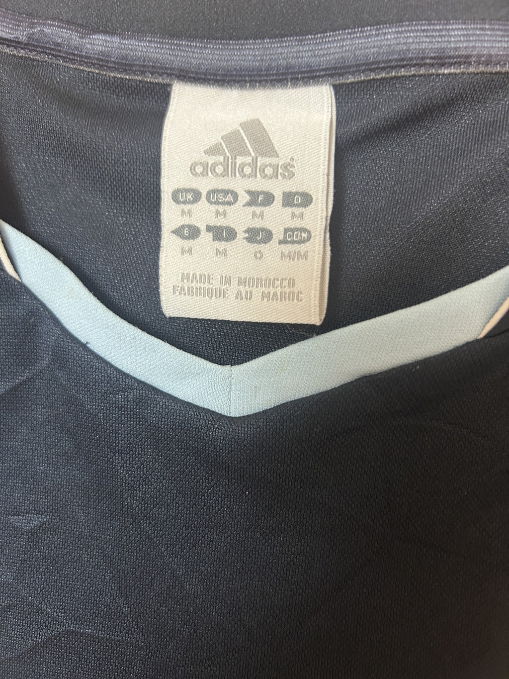 Adidas collar size tag M
